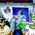 FILE PHOTO: Patients suffering from the coronavirus disease (COVID-19) get treatment at the casualty ward in Lok Nayak Jai Prakash (LNJP) hospital, amidst the spread of the disease in New Delhi
