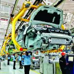 Workers assemble Ford cars at a plant of Ford India in Chengalpattu on the outskirts of Chennai
