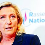 FILE PHOTO: French far right leader Marine Le Pen reacts to the results of regional election, in Nanterre